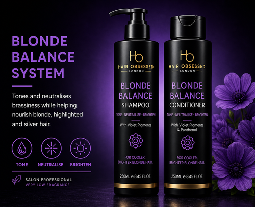Hair Obsessed Blonde Balance Shampoo and Conditioner on a dark background with purple flowers.
