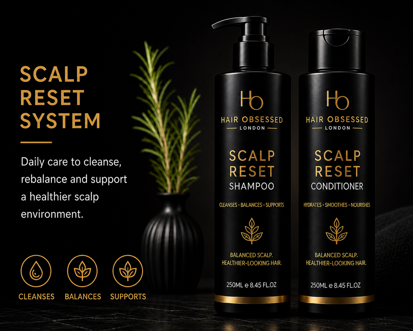 Hair Obsessed Scalp Reset Shampoo and Conditioner bottles with plant on a dark background